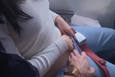 Don't get bored on the plane — put your hand down your panties and cum in public